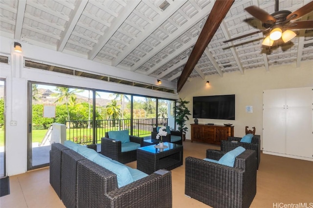 living area featuring a ceiling fan, high vaulted ceiling, and beamed ceiling
