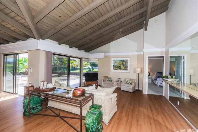 living room with wood finished floors, wooden ceiling, beamed ceiling, and a wealth of natural light
