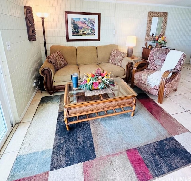 living room with light tile patterned floors and tile walls