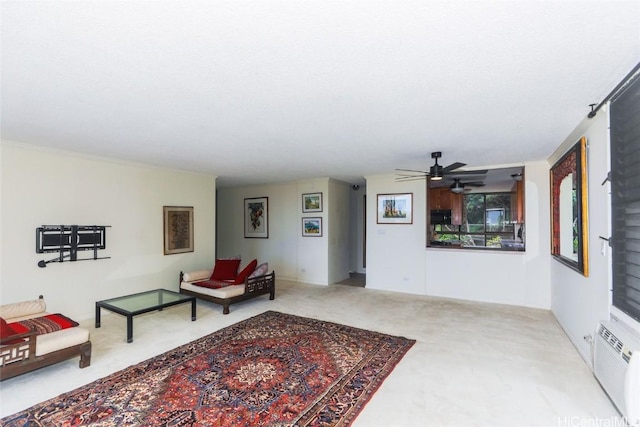 living room with carpet, a wall mounted air conditioner, and ceiling fan