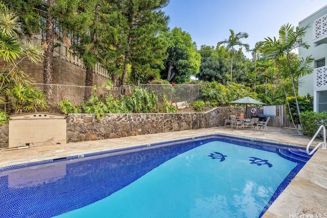 3061 Pualei Cir Unit 303, Honolulu, HI 96815 - view of pool featuring a fenced backyard and a patio