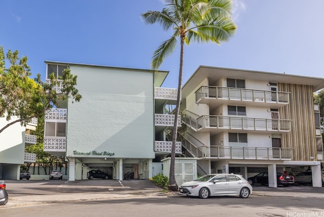 3061 Pualei Cir Unit 303, Honolulu, HI 96815 - view of apartment building / complex featuring covered parking