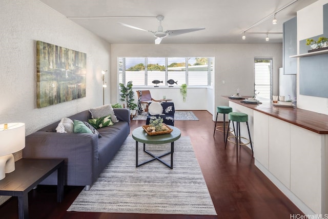 3061 Pualei Cir Unit 303, Honolulu, HI 96815 - living room with dark wood-type flooring, rail lighting, ceiling fan, and a textured wall