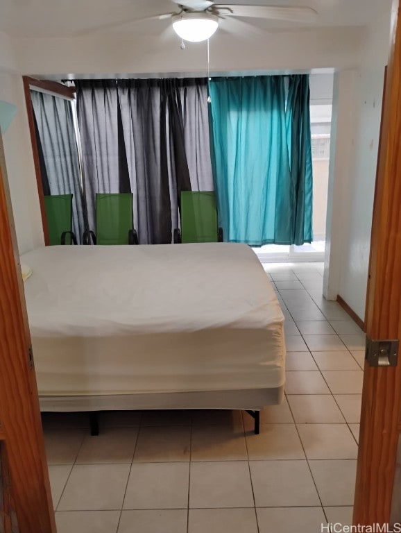 bedroom featuring tile patterned flooring and ceiling fan