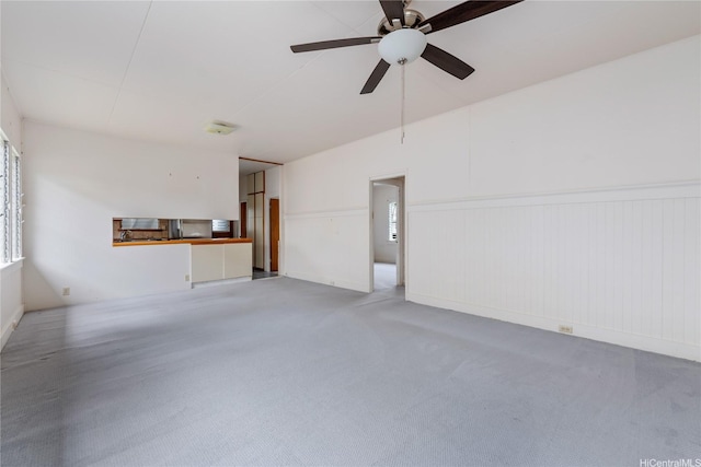 2712 Pulena Pl, Honolulu, HI 96822 - unfurnished living room featuring wainscoting, ceiling fan, and carpet floors