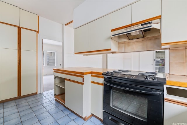 2712 Pulena Pl, Honolulu, HI 96822 - kitchen featuring black electric range oven, under cabinet range hood, white cabinetry, light tile patterned floors, and open shelves