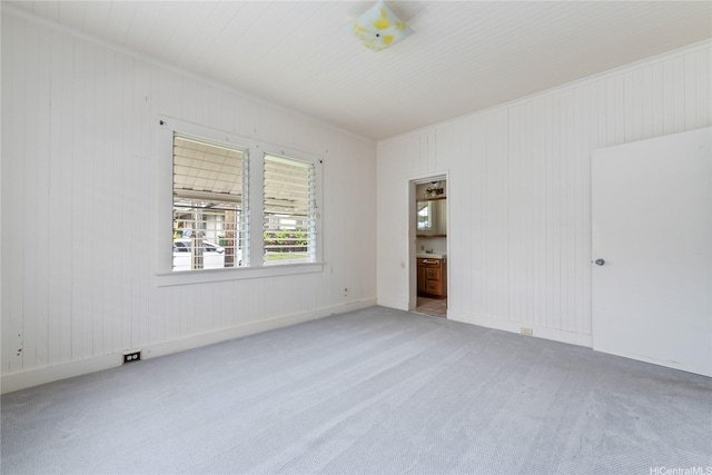 2712 Pulena Pl, Honolulu, HI 96822 - unfurnished bedroom with carpet flooring, ensuite bath, and wood walls