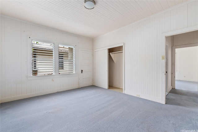 2712 Pulena Pl, Honolulu, HI 96822 - unfurnished bedroom with carpet flooring, a closet, and wooden walls