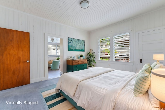 2712 Pulena Pl, Honolulu, HI 96822 - bedroom featuring multiple windows, carpet floors, wood walls, and ornamental molding