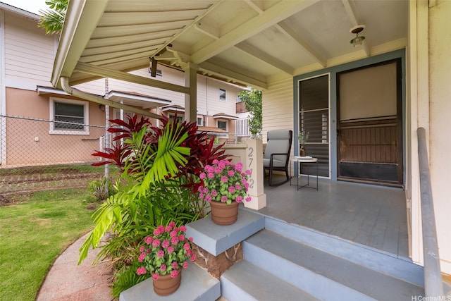 2712 Pulena Pl, Honolulu, HI 96822 - doorway to property featuring covered porch