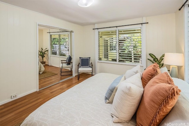 bedroom with wood finished floors