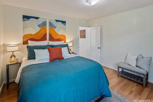 bedroom featuring wood finished floors