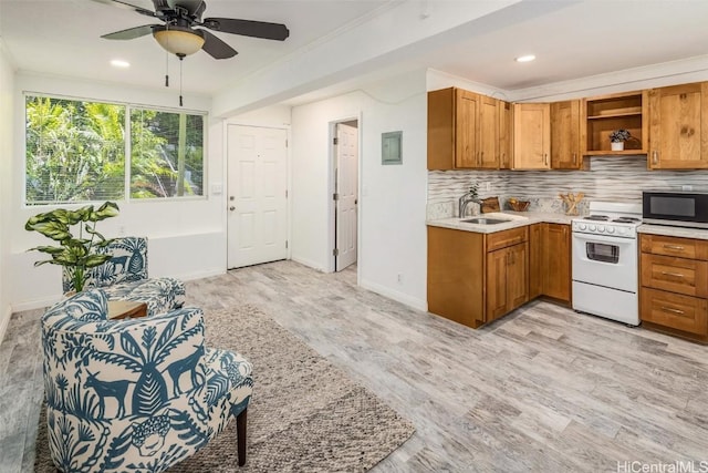 kitchen featuring electric range, open shelves, stainless steel microwave, backsplash, and light countertops