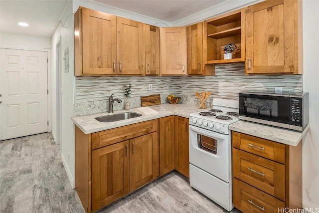 kitchen featuring white electric range oven, light stone countertops, black microwave, and a sink