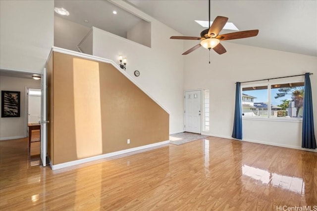 48 Kuuhale Pl, Kahului, HI 96732 - unfurnished living room with wood finished floors, high vaulted ceiling, and ceiling fan