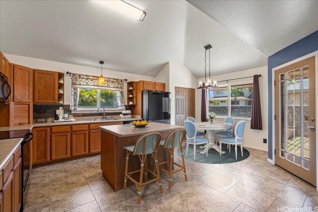 48 Kuuhale Pl, Kahului, HI 96732 - kitchen featuring brown cabinets, black appliances, a sink, open shelves, and vaulted ceiling