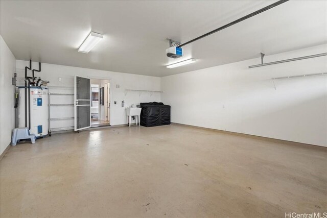 48 Kuuhale Pl, Kahului, HI 96732 - garage with a garage door opener, water heater, and a sink