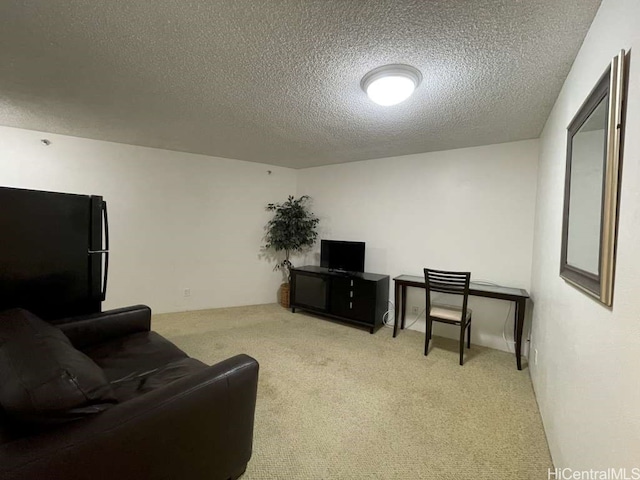 carpeted living room featuring a textured ceiling