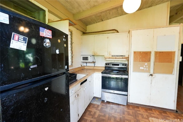 kitchen featuring electric stove, lofted ceiling with beams, freestanding refrigerator, light countertops, and white microwave