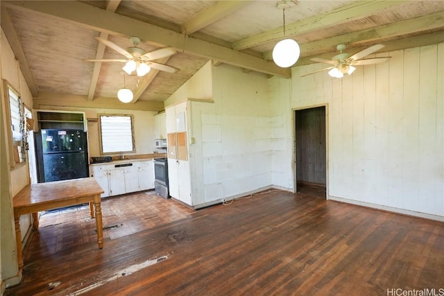 kitchen featuring white microwave, ceiling fan, stainless steel electric range oven, freestanding refrigerator, and dark wood-style flooring