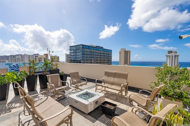 2345 Ala Wai Blvd Unit 1003, Honolulu, HI 96815 - view of patio with an outdoor fire pit and a water view
