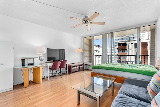 2345 Ala Wai Blvd Unit 1003, Honolulu, HI 96815 - living area featuring wood finished floors, ceiling fan, a textured ceiling, and an office area