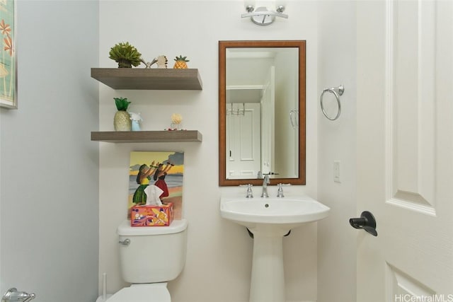 bathroom with toilet and a sink