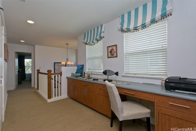 office space with light carpet, recessed lighting, and built in study area