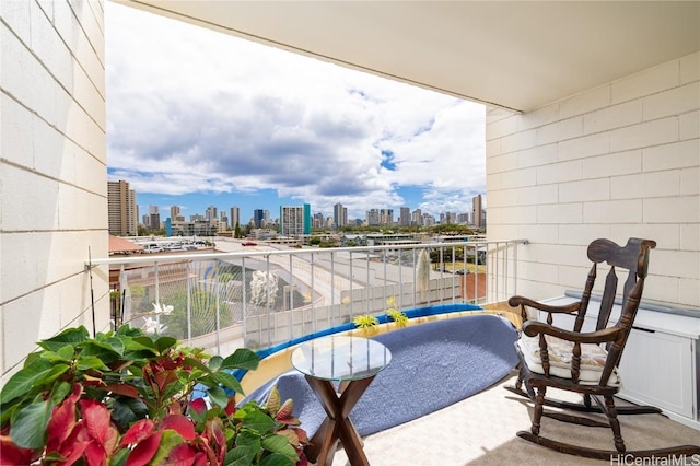 balcony featuring a city view