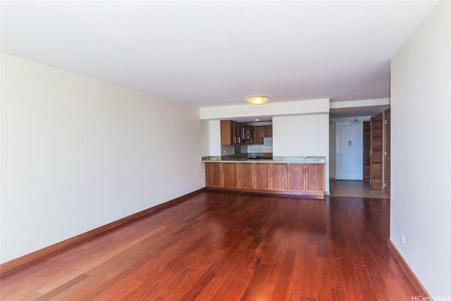 1350 Ala Moana Blvd Unit 3012, Honolulu, HI 96814 - unfurnished living room featuring dark wood-type flooring and baseboards