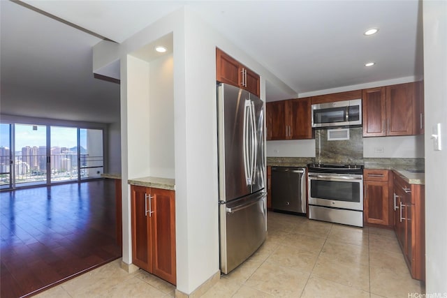 1350 Ala Moana Blvd Unit 3012, Honolulu, HI 96814 - kitchen with stainless steel appliances, light tile patterned flooring, recessed lighting, and decorative backsplash