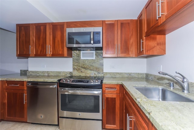 1350 Ala Moana Blvd Unit 3012, Honolulu, HI 96814 - kitchen featuring stainless steel appliances, a sink, light stone countertops, dark brown cabinets, and light tile patterned floors