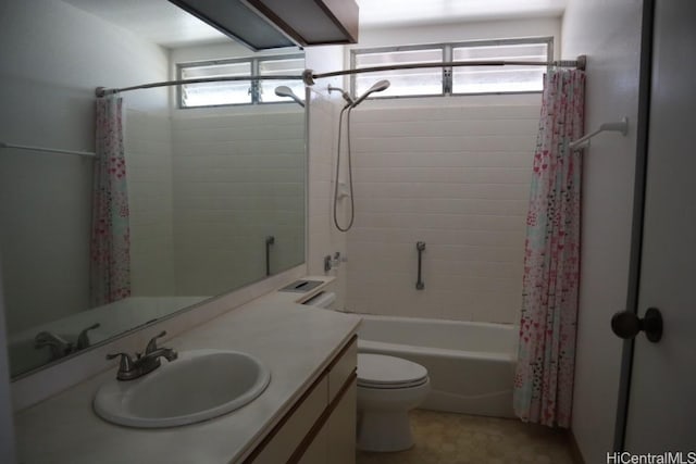 bathroom with vanity, toilet, and shower / bath combo with shower curtain