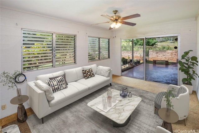 living area featuring a ceiling fan