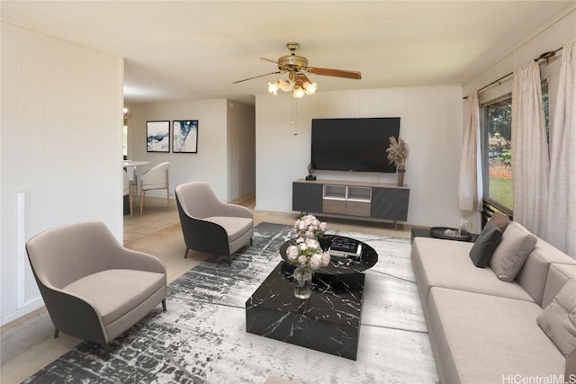 living area featuring tile patterned flooring and a ceiling fan