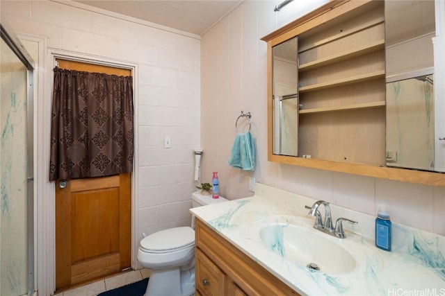 bathroom with a shower with door, toilet, and vanity