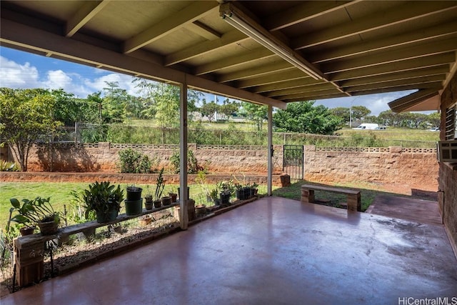 view of patio featuring fence