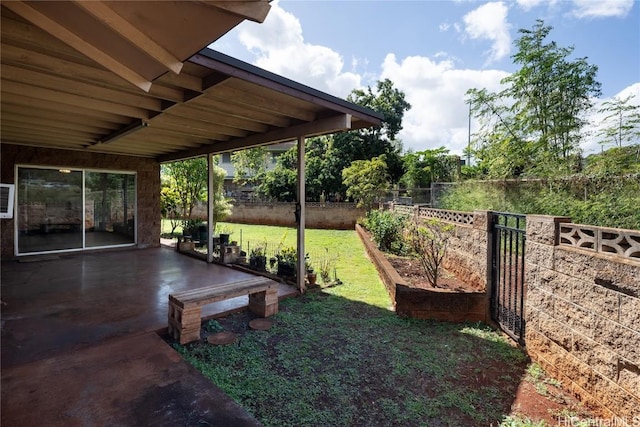 view of yard featuring a patio area and fence