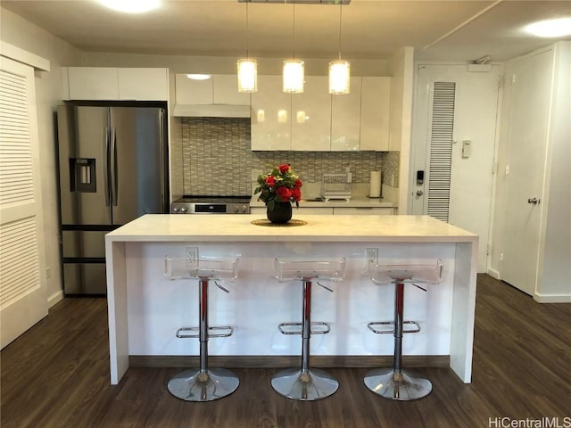 kitchen with tasteful backsplash, stainless steel fridge with ice dispenser, light countertops, dark wood-style floors, and white cabinets