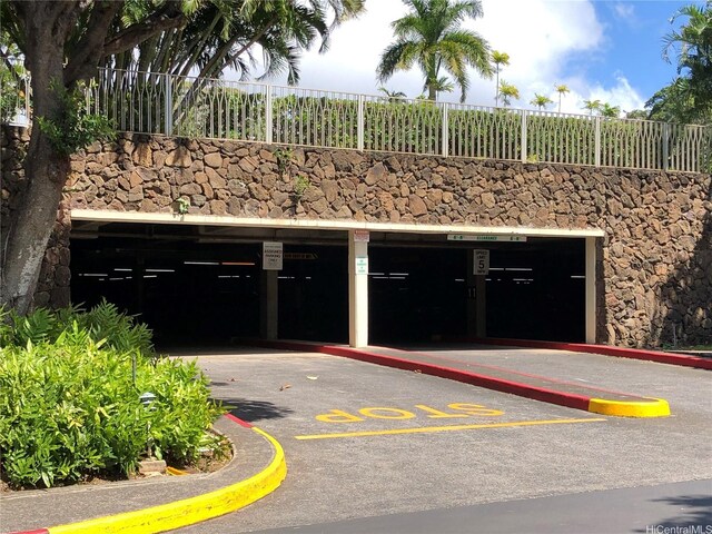 1519 Nuuanu Ave Unit 142, Honolulu, HI 96817 - garage featuring uncovered parking and fence