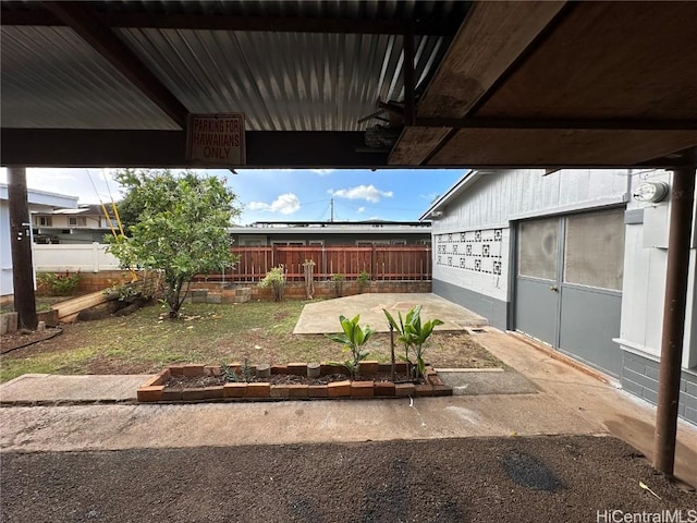 view of yard with fence and a garden