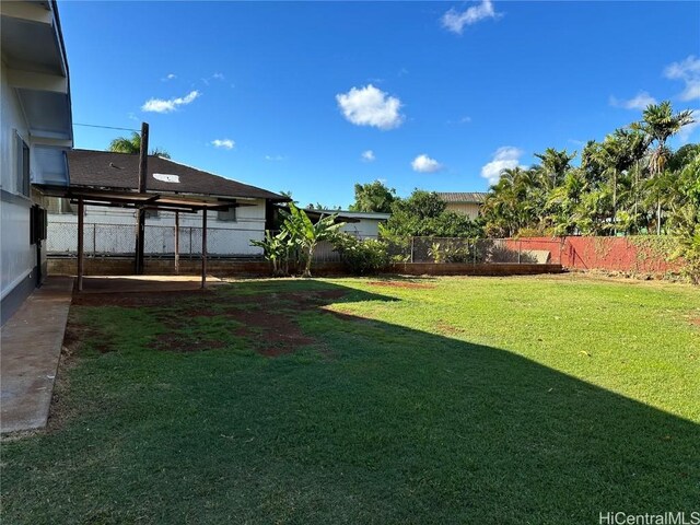 view of yard with a fenced backyard