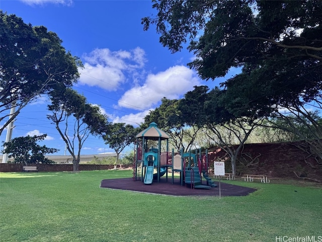 community jungle gym with a lawn