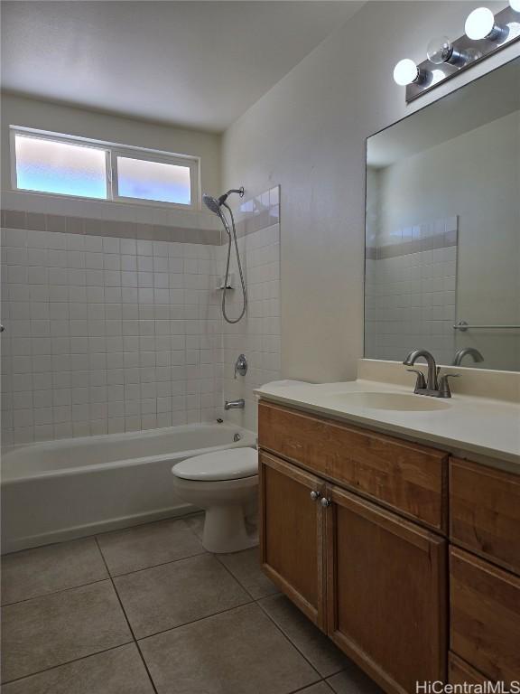 full bath featuring tile patterned floors, shower / tub combination, vanity, and toilet