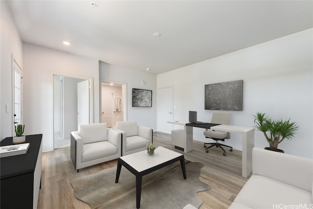 living area featuring recessed lighting and light wood-style flooring