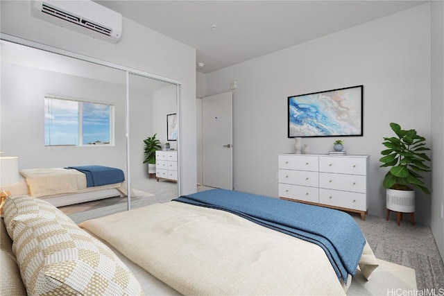 carpeted bedroom featuring a wall mounted air conditioner and a closet