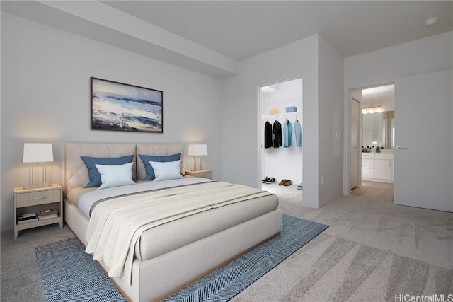 carpeted bedroom featuring a spacious closet and connected bathroom