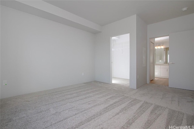 spare room with light carpet