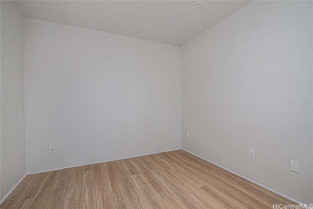 unfurnished room featuring light wood-style floors