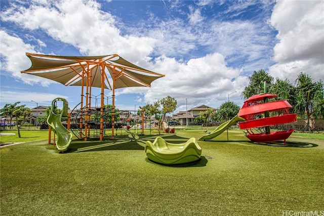 community play area with a lawn